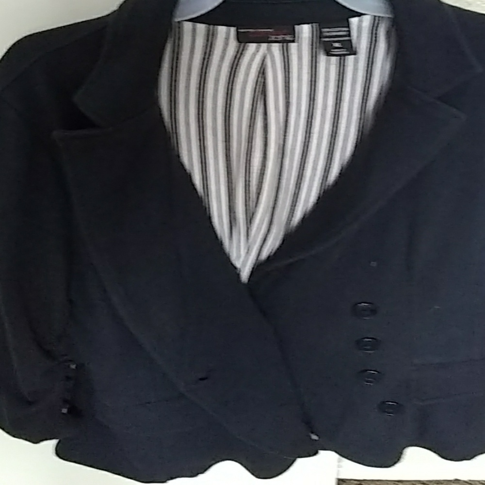 Navy, waist length blazer. Striped and soft inside